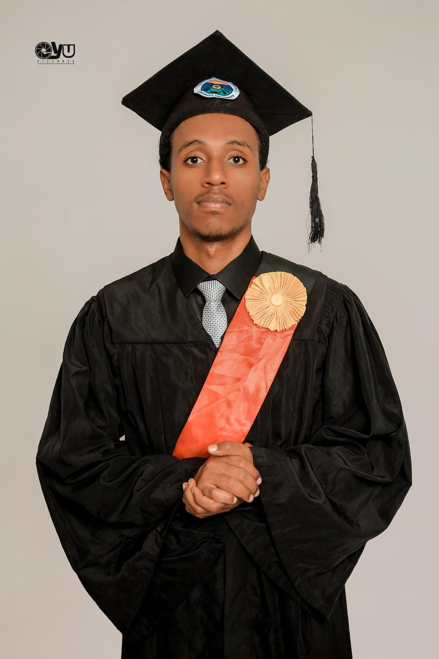 Alpha Guyasa in graduation dress